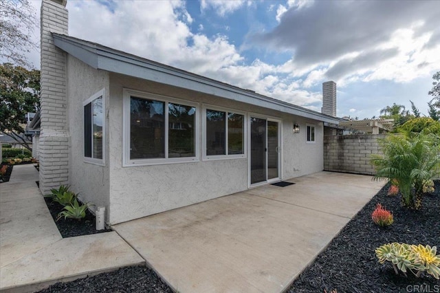 rear view of house featuring a patio area