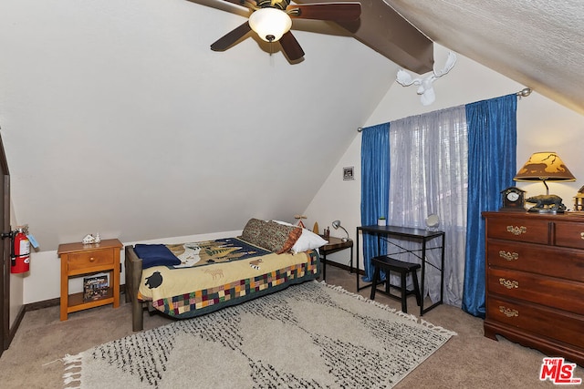 carpeted bedroom with vaulted ceiling with beams and ceiling fan