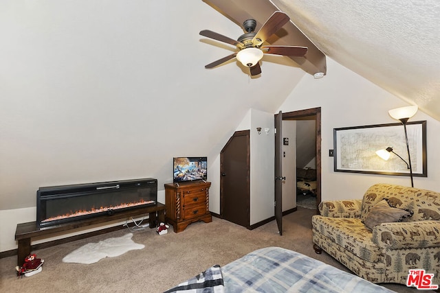 carpeted bedroom with lofted ceiling and ceiling fan