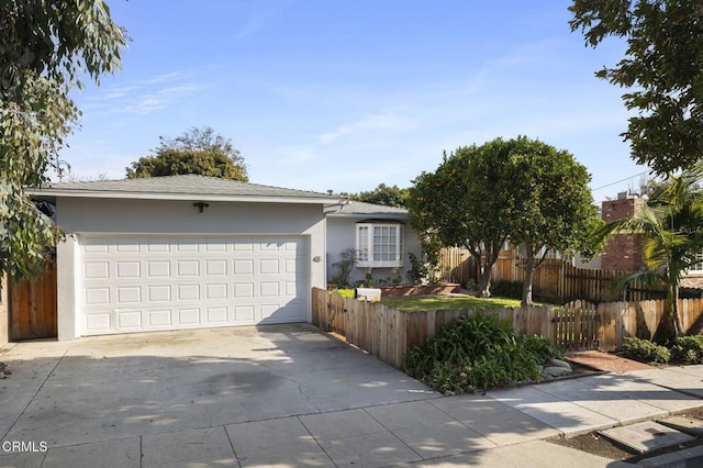 ranch-style house featuring a garage