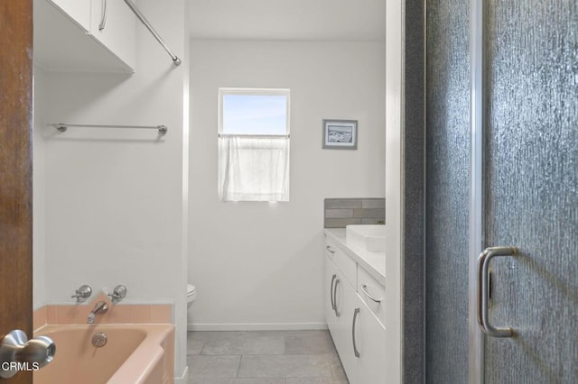 bathroom featuring vanity, tile patterned flooring, and a bathing tub