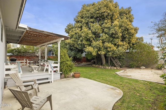 view of patio with a wooden deck and a pergola