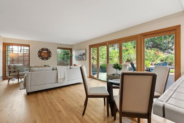 dining space featuring light wood-type flooring