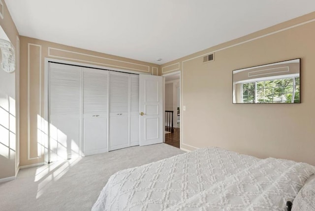 carpeted bedroom featuring a closet