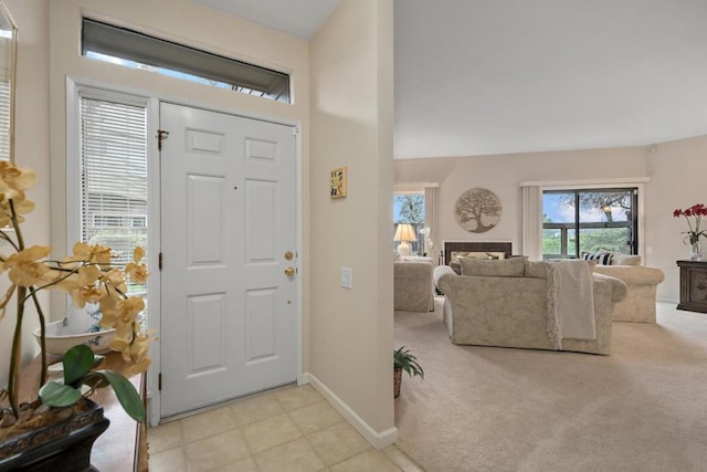 entryway featuring light carpet