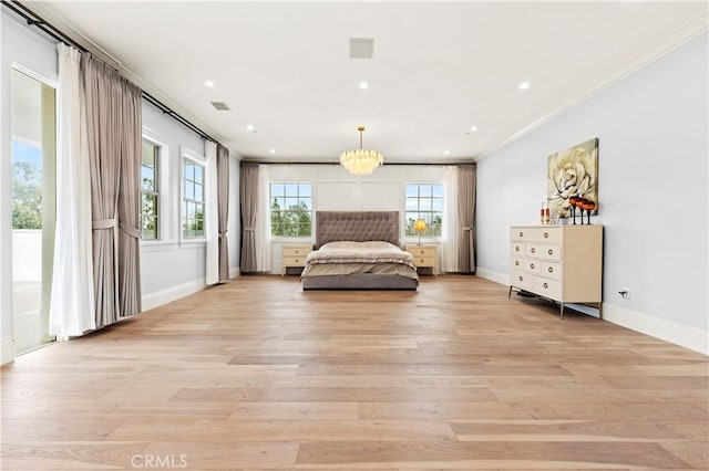 bedroom with crown molding, a chandelier, and light wood-type flooring