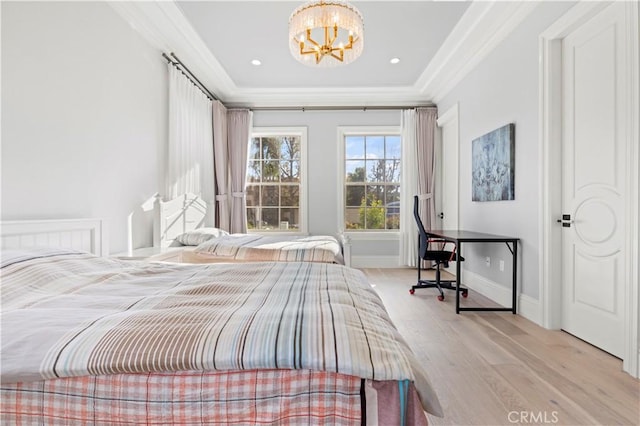 bedroom with crown molding, a chandelier, and light hardwood / wood-style floors