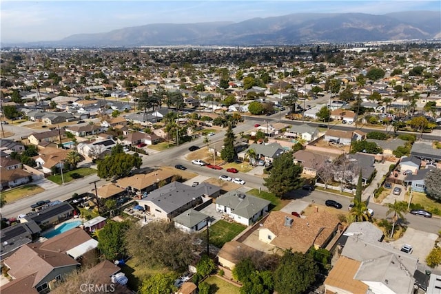 birds eye view of property featuring a mountain view