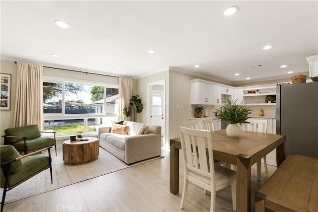 dining space with light wood-type flooring