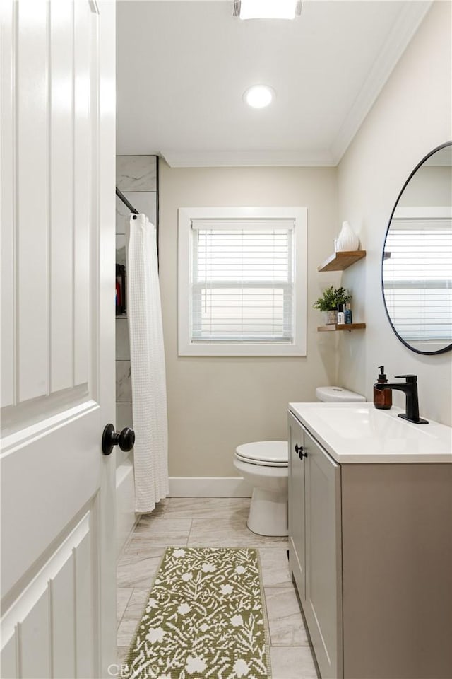 bathroom with vanity, ornamental molding, and toilet