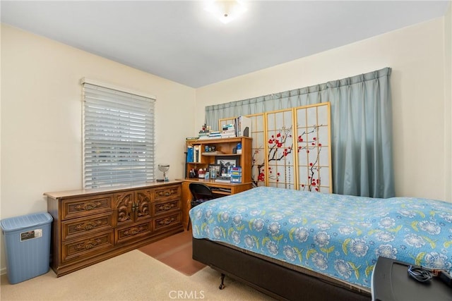 bedroom with light colored carpet