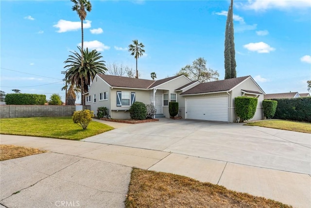 ranch-style home with a garage and a front yard