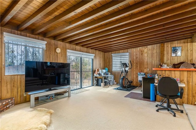 carpeted office featuring beamed ceiling, wood ceiling, and wood walls