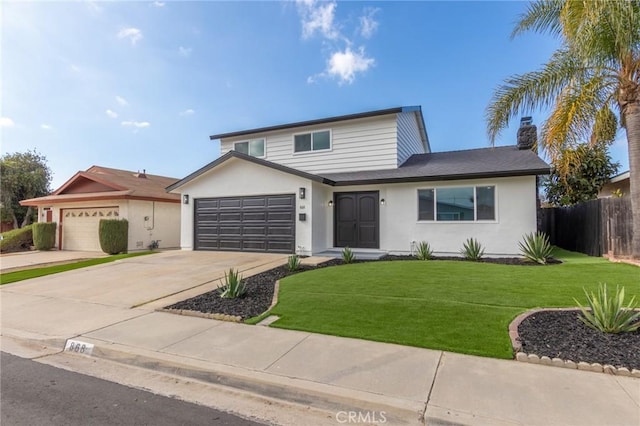 view of front property featuring a garage and a front yard