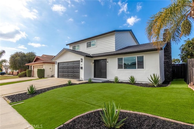 view of front of property with a garage and a front yard