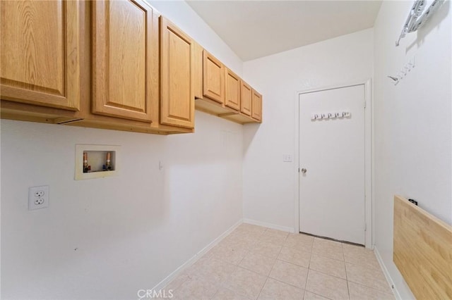 laundry room with cabinets, hookup for a washing machine, and light tile patterned floors