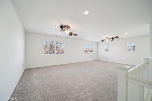 carpeted empty room with ceiling fan