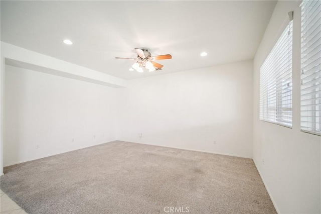 carpeted empty room with ceiling fan