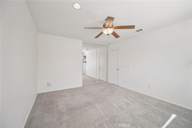 unfurnished room with light carpet and ceiling fan