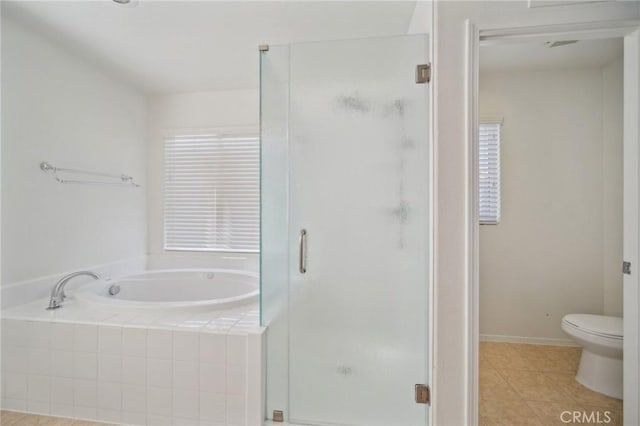 bathroom with toilet, separate shower and tub, and tile patterned flooring