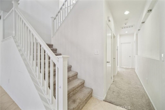 stairs with carpet floors