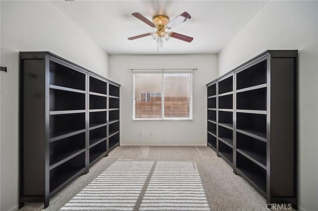 interior space with ceiling fan