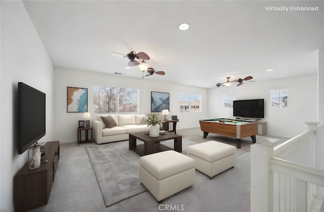 living room with ceiling fan, pool table, and light carpet