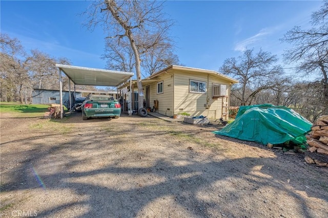 view of side of home featuring a carport