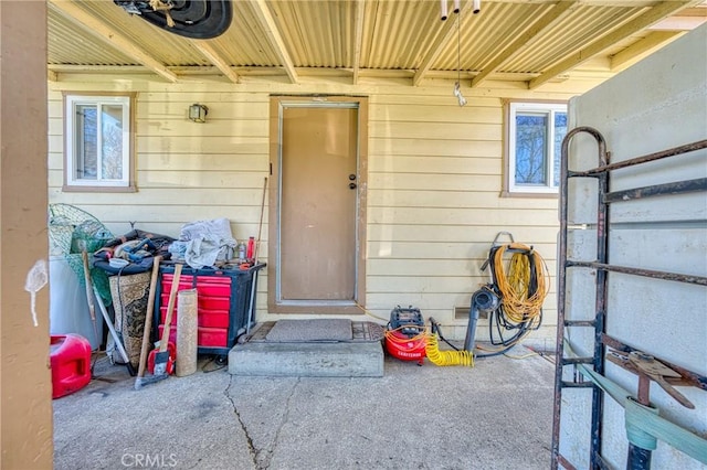 property entrance featuring a patio area