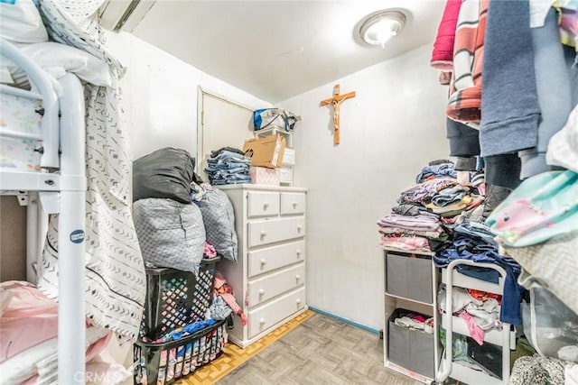 spacious closet with light parquet flooring