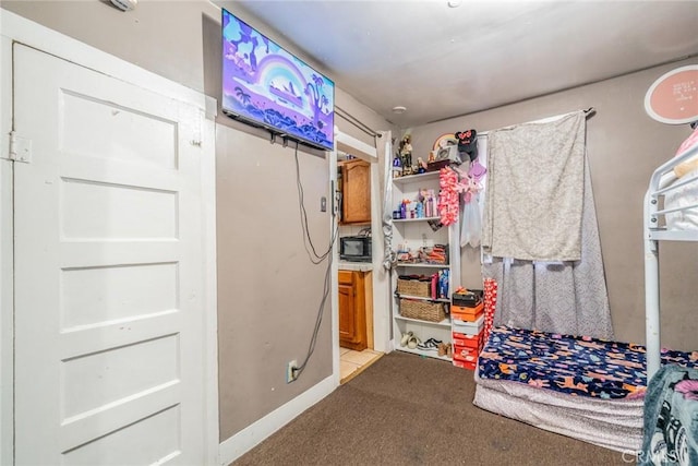 bedroom featuring light carpet