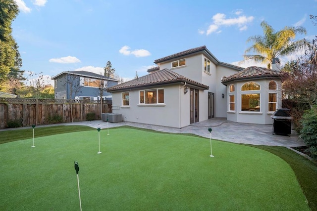 back of house with a patio