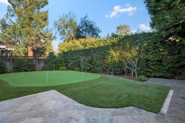 view of property's community with a patio area