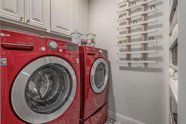 washroom with cabinets and separate washer and dryer