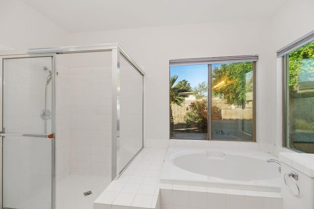 bathroom with separate shower and tub