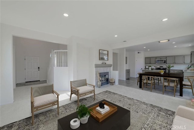 carpeted living room with a fireplace