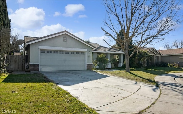 ranch-style house featuring a garage and a front lawn