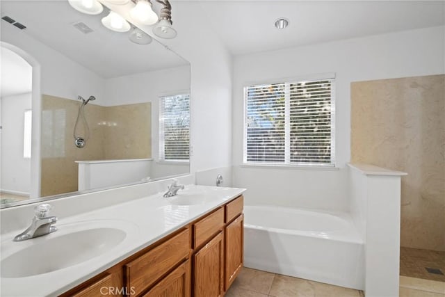 bathroom featuring vanity, separate shower and tub, and tile patterned floors