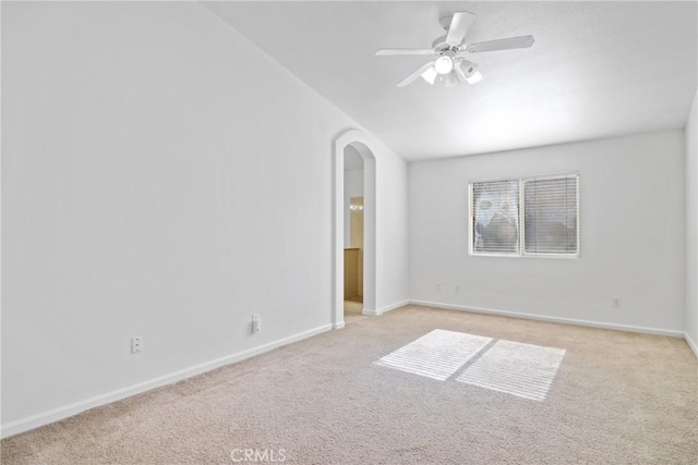 unfurnished room featuring ceiling fan and light colored carpet