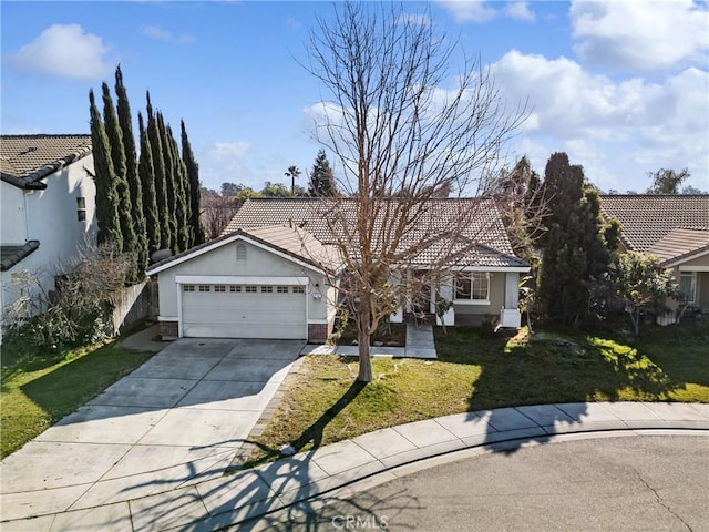 view of front of house with a garage and a front yard