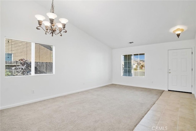 interior space featuring lofted ceiling, light colored carpet, and a notable chandelier