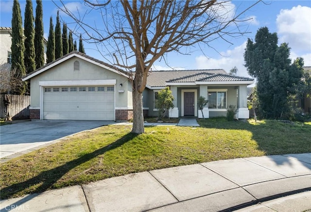 ranch-style house with a garage and a front yard