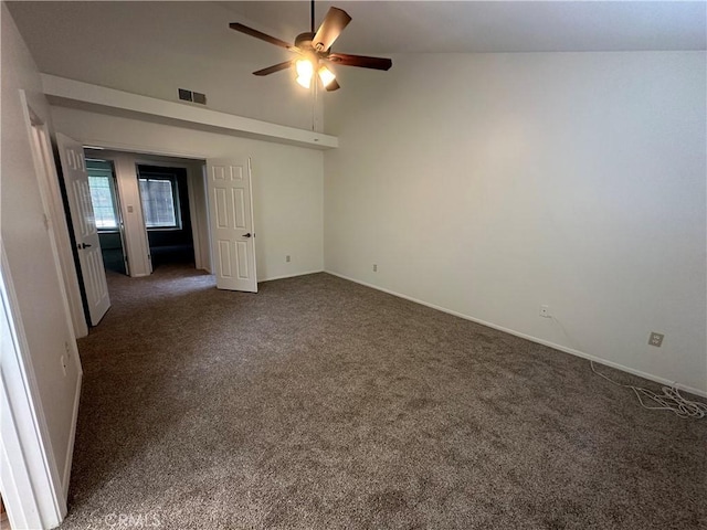 unfurnished room with dark colored carpet, high vaulted ceiling, baseboards, ceiling fan, and visible vents