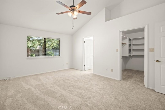 7205 Bandolero Way, Bakersfield, CA 93308 - unfurnished bedroom featuring light carpet, a walk in closet, baseboards, a ceiling fan, and a closet
