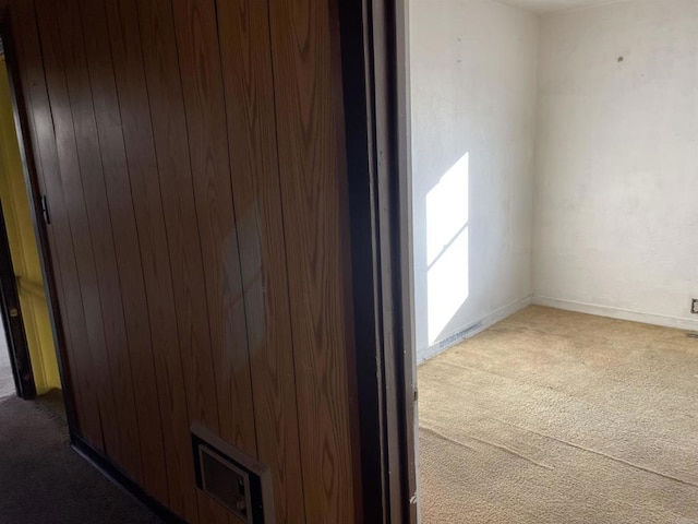 unfurnished room featuring carpet