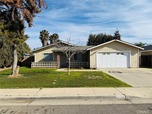 ranch-style house with driveway, an attached garage, fence, and a front lawn