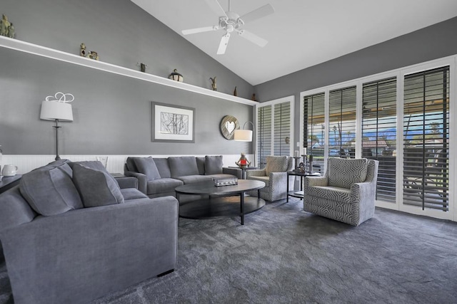 living room featuring high vaulted ceiling, ceiling fan, and dark colored carpet