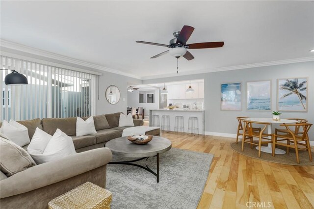 3140 Sumatra Pl, Costa Mesa, CA 92626 - living area featuring ceiling fan, light wood-type flooring, crown molding, and baseboards