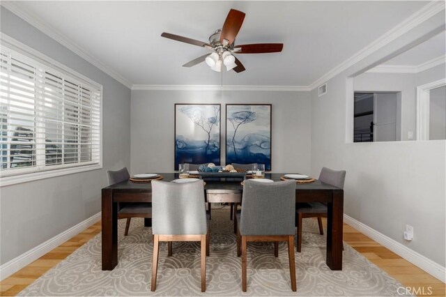 3140 Sumatra Pl, Costa Mesa, CA 92626 - dining space with light wood-style floors, ceiling fan, baseboards, and crown molding