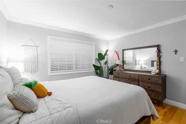 3140 Sumatra Pl, Costa Mesa, CA 92626 - bedroom featuring ornamental molding, baseboards, and wood finished floors